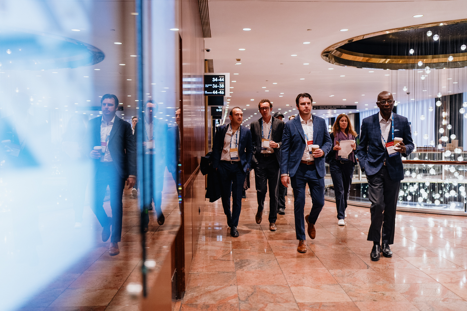 People walking the hallway at SEM Consortium 2025