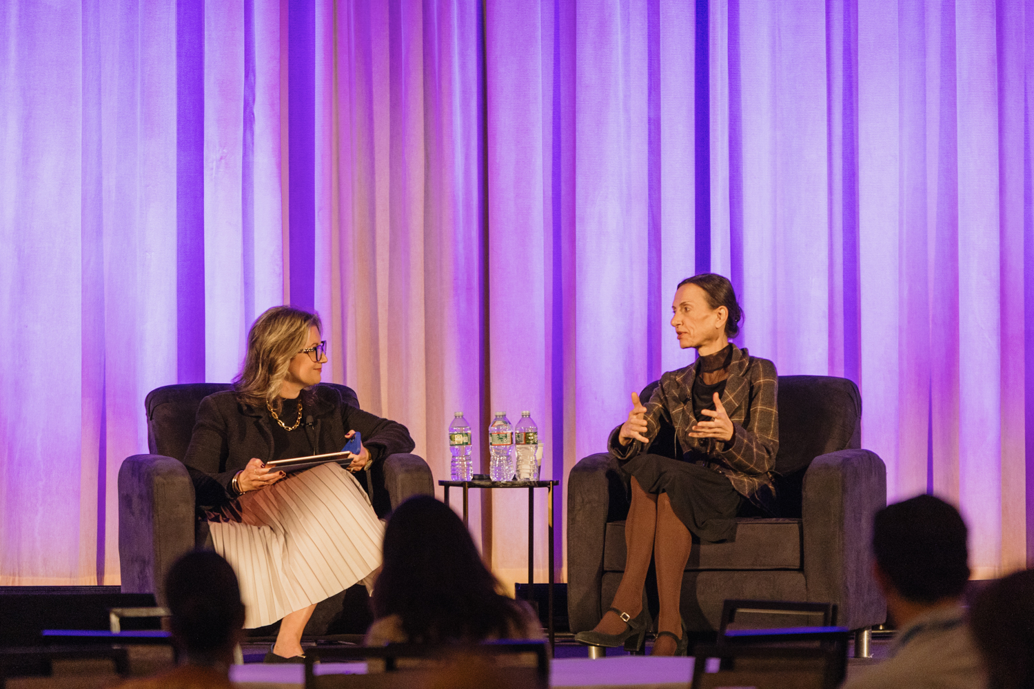 Two female panelists on stage at SEM Consortium 2025